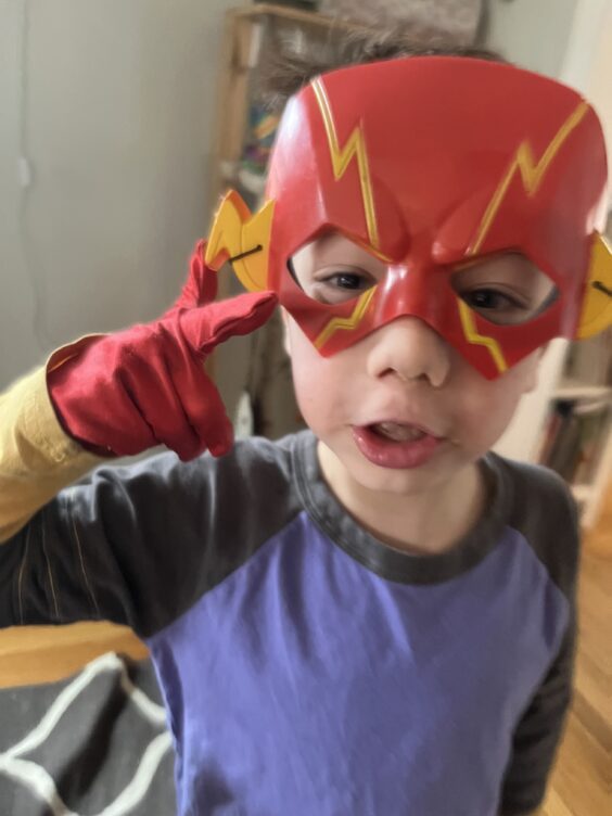 Myron wearing The Flash mask and gloves